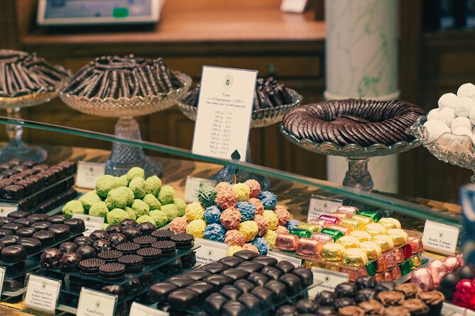 A Morning in Paris Food Tour: Croissants, Baguettes & Chocolate - Alain Ducasse chocolate and the covered arcades