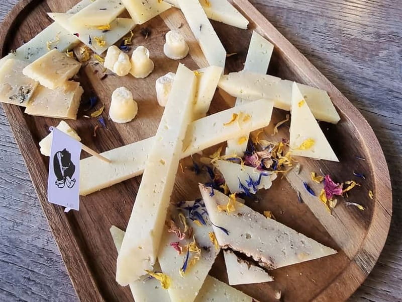 Ajaccio: Local Food Tour with Tastings - Sheep and goat cheeses in a small shop