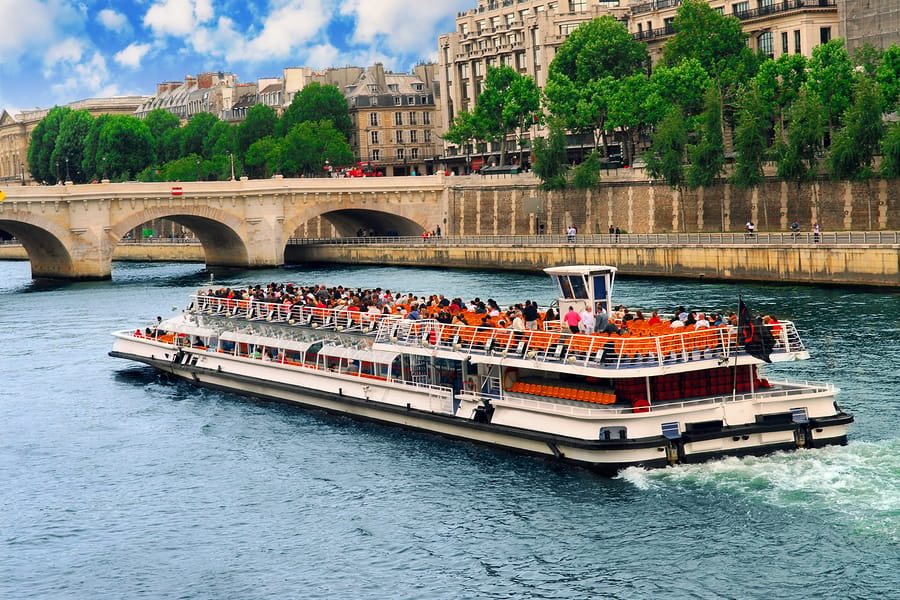 From London: Paris Day Trip with Lunch on Eiffel Tower - Cruising beneath Paris landmarks on the Seine