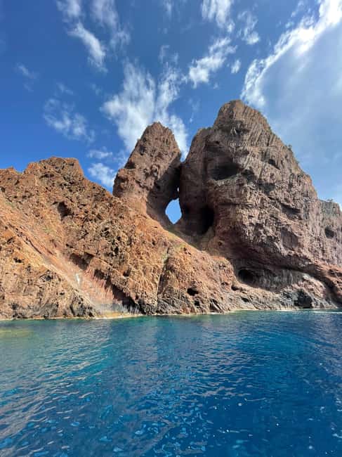 From Sagone/Cargèse: Piana, Scandola, Girolata Boat Tour - Omigna Genoese Tower sets the scene