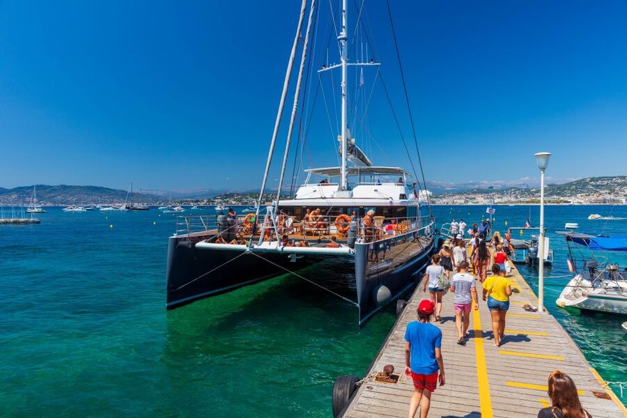 Full-Day Catamaran Cruise Departing from Cannes - Sailing toward the Esterel Massif