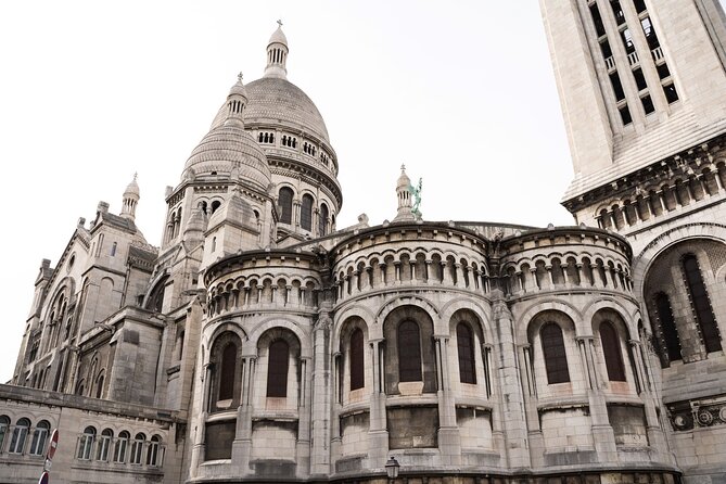 Hidden Montmartre: Paris' Secret Streets Walking Tour - Windmills, expensive houses, and a secret passage