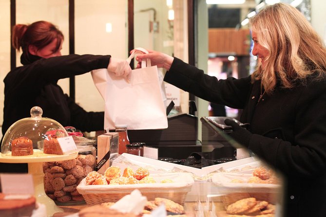 Lyon Morning Food Market Tasting Tour in Les Halles Paul Bocuse - Reliability, meeting points, and cancellation terms