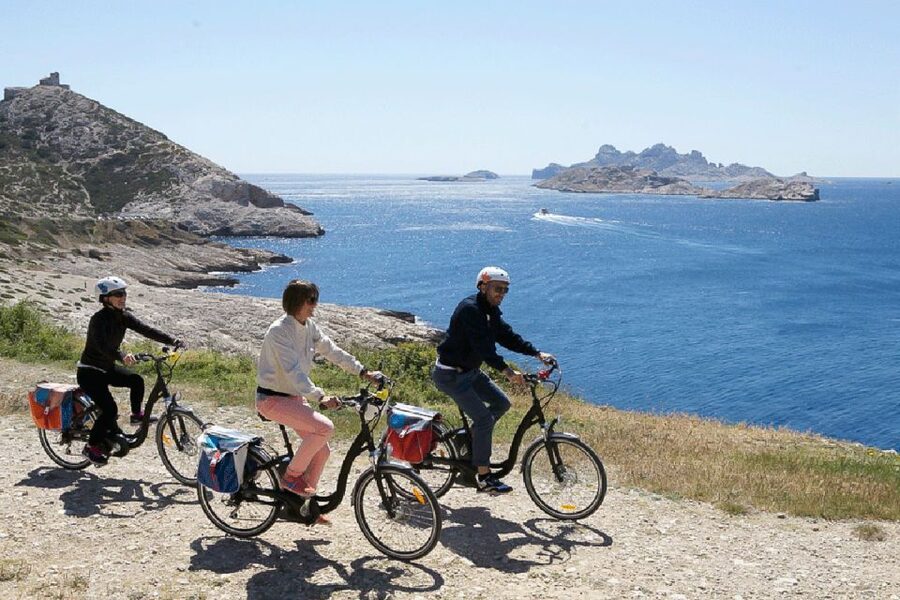 Marseille: Full-Day Guided E-Bike Coast & Calanques Tour - Goudes and the turn toward wilder coast