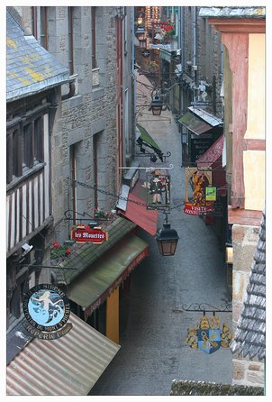 Mont Saint Michel Guided Day Trip with Abbey Entry from Paris - Climbing through the fortifications