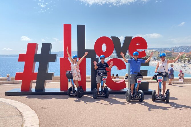 Nice City Segway Sightseeing Tour - Blue chairs, a small Statue of Liberty, and local symbols