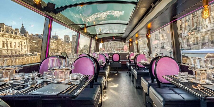 Paris: Bus Toqué Tour with 5-Course Dinner and Champagne - Paris sightseeing with a table set for dinner