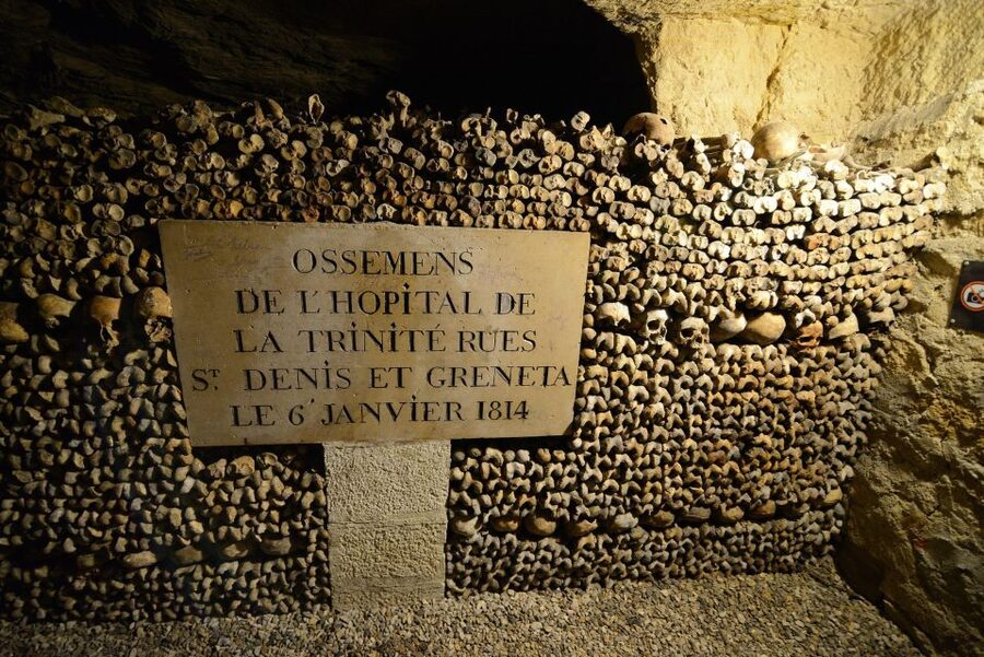 Paris: Catacombs Entry & Seine River Cruise with Audio Guide - Entering the Catacombs beneath Paris