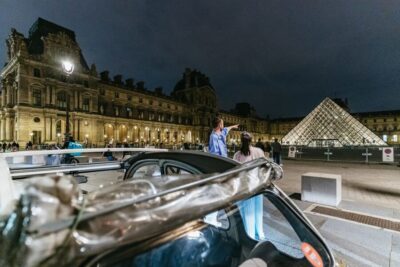 Discover Paris by Night in a Vintage Car with a Local