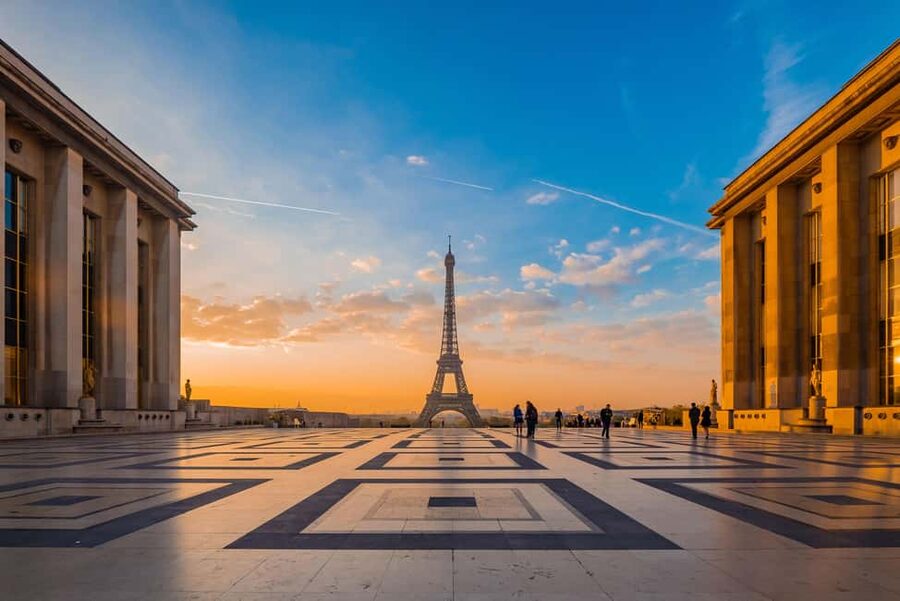 Paris: Eiffel Tower Guided Tour|Summit & second floor access - At the base: the story begins beneath the iron arches
