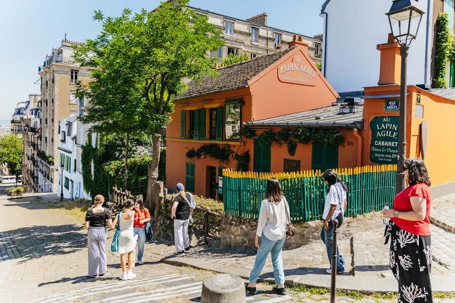 Paris: Hidden Gems of Montmartre with Local Guide - Moulin de la Galette and the old village atmosphere