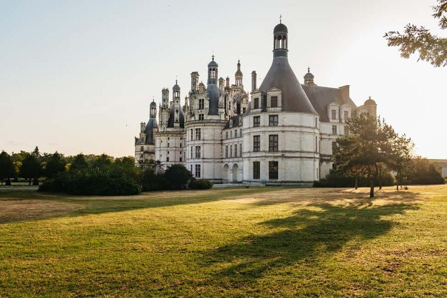 Paris: Loire Valley Chambord Castle, Wine Tasting & Lunch - Inside Château de Chambord’s grand design