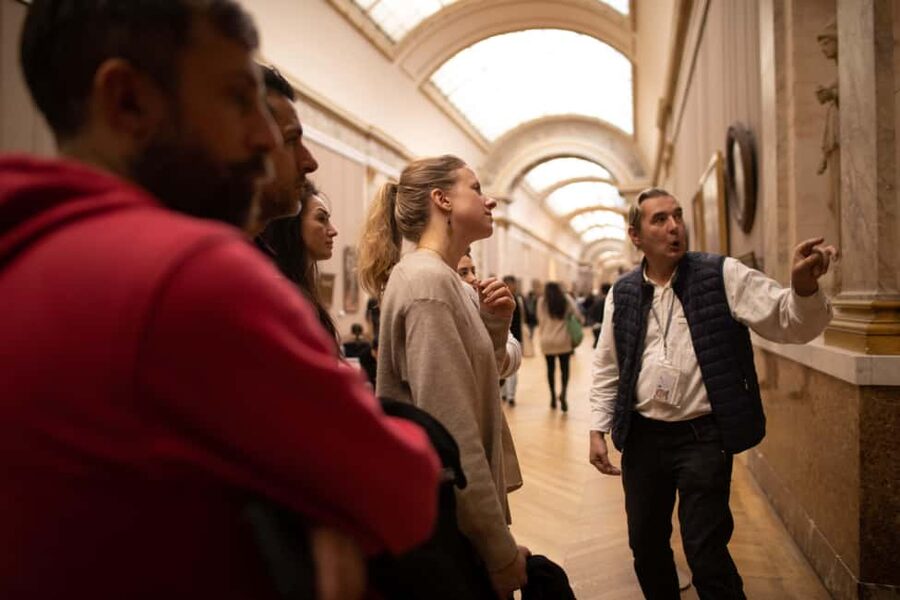 Paris Louvre Exclusive Semi Private Guided Tour Max 6 People - Entering through the Louvre Pyramid