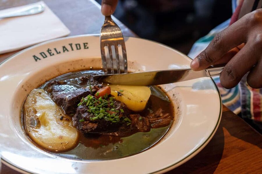 Paris: Montmartre Food Tour with Full Meal - Place des Abbesses and the sweet side of Paris