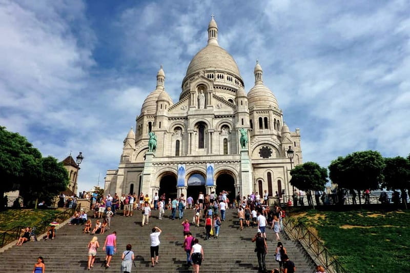Paris: Montmartre Hidden Gems and Highlights Walking Tour - Climbing toward Sacré-Coeur