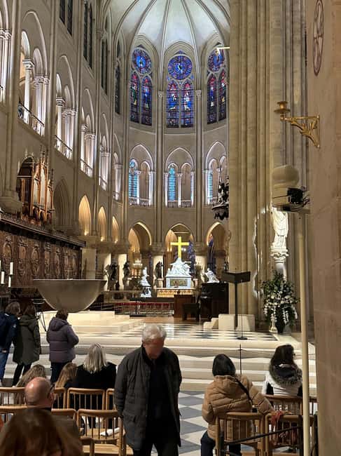 Paris: Notre Dame Cathedral Guided Tour of the Neighborhood - Reading the renovated Notre-Dame façade