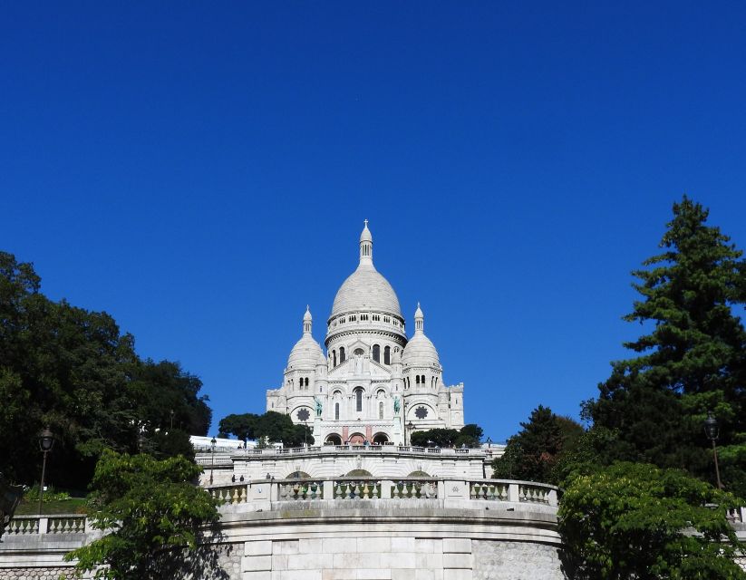 Paris: Sacré-Coeur and Montmartre Tour with Expert Guide - The climb to Sacré-Coeur and its white stone