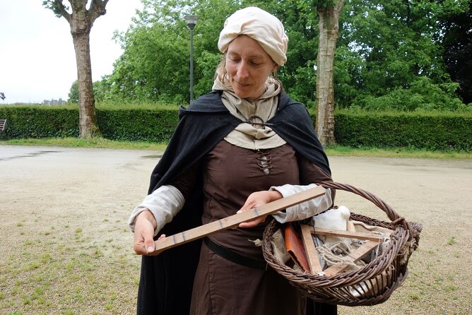 Unusual guided tour of Dinan immersed in the Middle Ages - Moving from fortifications into the old streets